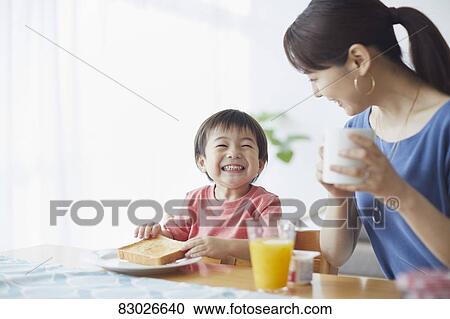 Japanese mother and kid having breakfast View Large Photo Image Stock Image - Japanese mother and kid having breakfast. Fotosearch