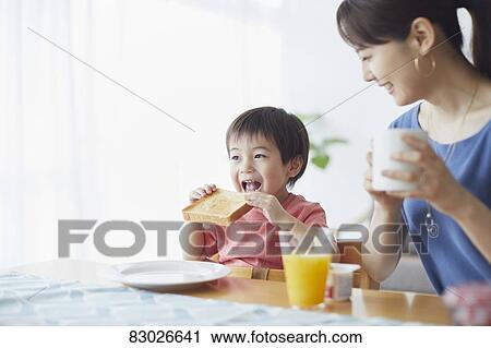 Japanese mother and kid having breakfast View Large Photo Image Stock Image - Japanese mother and kid having breakfast. Fotosearch