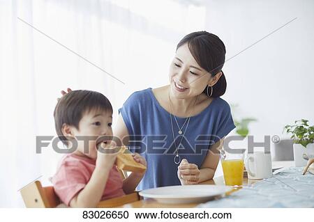 Japanese mother and kid having breakfast View Large Photo Image Stock Image - Japanese mother and kid having breakfast. Fotosearch