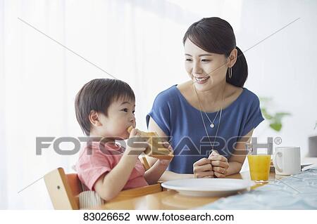 Japanese mother and kid having breakfast View Large Photo Image Stock Image - Japanese mother and kid having breakfast. Fotosearch