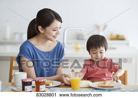 Japanese mother and kid having breakfast View Large Photo Image Stock Image - Japanese mother and kid having breakfast. Fotosearch
