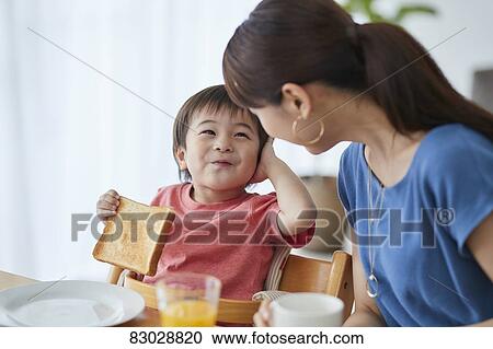 Japanese mother and kid having breakfast View Large Photo Image Stock Image - Japanese mother and kid having breakfast. Fotosearch