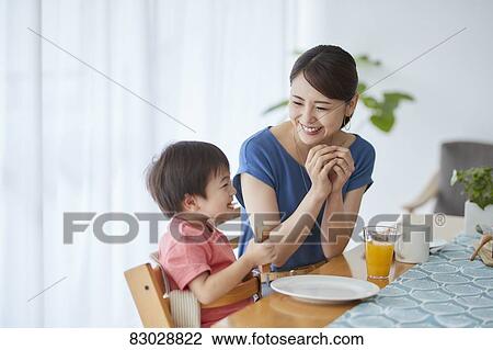 Japanese mother and kid having breakfast View Large Photo Image Stock Image - Japanese mother and kid having breakfast. Fotosearch