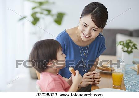Japanese mother and kid having breakfast View Large Photo Image Stock Image - Japanese mother and kid having breakfast. Fotosearch