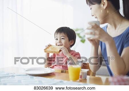 Japanese mother and kid having breakfast View Large Photo Image Stock Photo - Japanese mother and kid having breakfast. Fotosearch