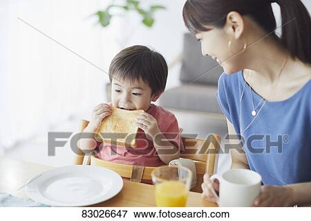 Japanese mother and kid having breakfast View Large Photo Image Stock Photo - Japanese mother and kid having breakfast. Fotosearch
