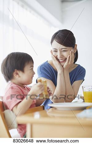 Japanese mother and kid having breakfast View Large Photo Image Stock Photo - Japanese mother and kid having breakfast. Fotosearch