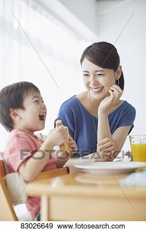 Japanese mother and kid having breakfast View Large Photo Image Stock Photo - Japanese mother and kid having breakfast. Fotosearch