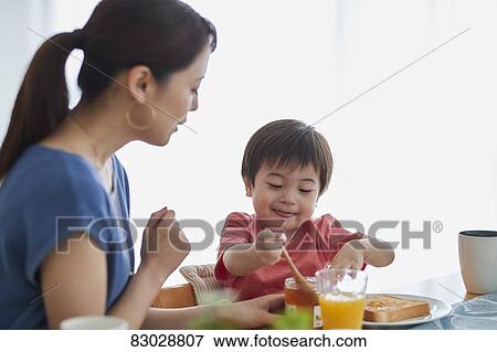 Japanese mother and kid having breakfast View Large Photo Image Stock Photo - Japanese mother and kid having breakfast. Fotosearch