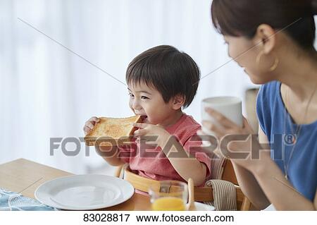 Japanese mother and kid having breakfast View Large Photo Image Stock Photo - Japanese mother and kid having breakfast. Fotosearch