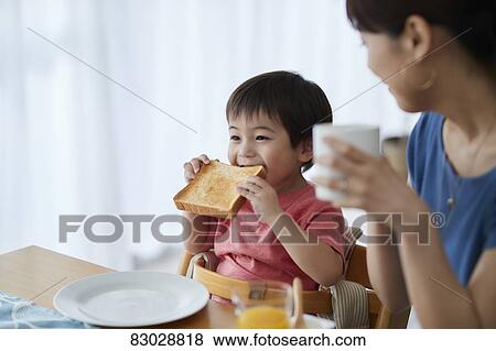 Japanese mother and kid having breakfast View Large Photo Image Stock Photo - Japanese mother and kid having breakfast. Fotosearch