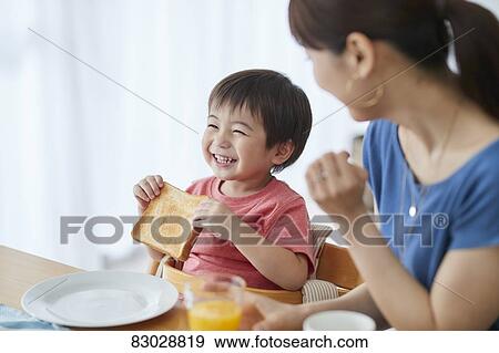 Japanese mother and kid having breakfast View Large Photo Image Stock Photo - Japanese mother and kid having breakfast. Fotosearch