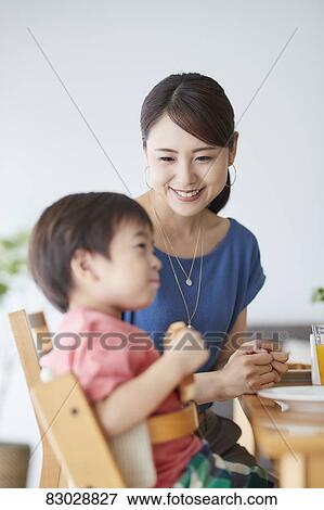 Japanese mother and kid having breakfast View Large Photo Image Stock Photo - Japanese mother and kid having breakfast. Fotosearch