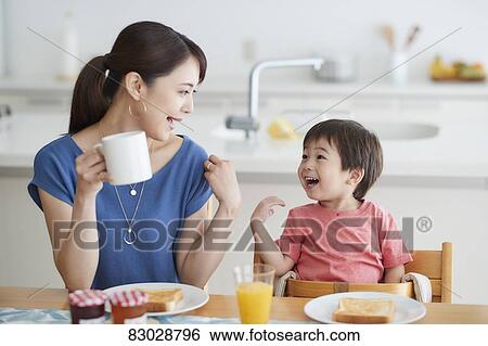 Japanese mother and kid having breakfast View Large Photo Image Stock Photograph - Japanese mother and kid having breakfast. Fotosearch