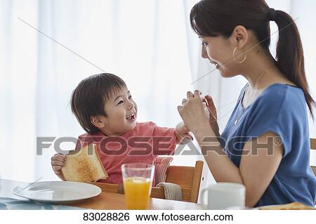 Japanese mother and kid having breakfast View Large Photo Image Stock Photograph - Japanese mother and kid having breakfast. Fotosearch