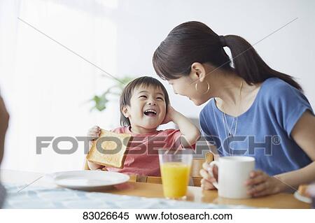 Japanese mother and kid having breakfast View Large Photo Image Stock Photography - Japanese mother and kid having breakfast. Fotosearch