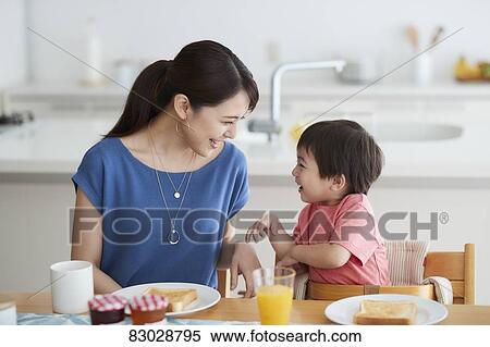 Japanese mother and kid having breakfast View Large Photo Image Stock Photography - Japanese mother and kid having breakfast. Fotosearch