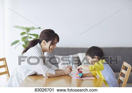 Stock Image - Japanese mother and kid playing. Fotosearch