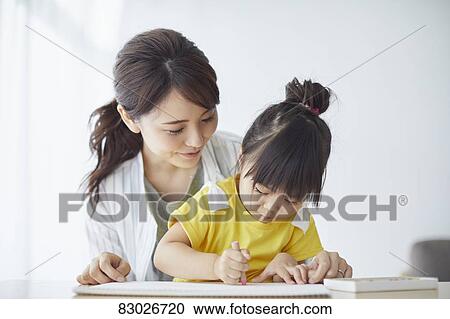 Stock Image - Japanese mother and kid playing. Fotosearch