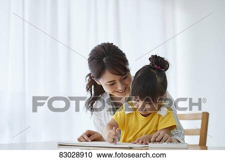 Stock Image - Japanese mother and kid playing. Fotosearch