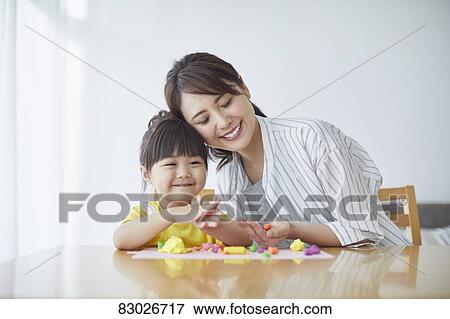 Japanese mother and kid playing View Large Photo Image Stock Photo - Japanese mother and kid playing. Fotosearch