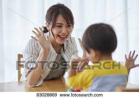 Stock Photo - Japanese mother and kid playing. Fotosearch