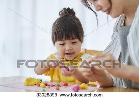 Japanese mother and kid playing View Large Photo Image Stock Photo - Japanese mother and kid playing. Fotosearch