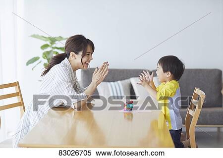 Stock Photography - Japanese mother and kid playing. Fotosearch
