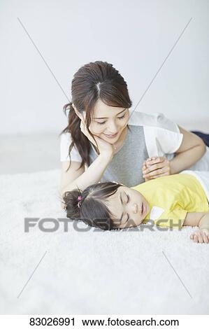 Japanese mother with sleeping kid View Large Photo Image Stock Image - Japanese mother with sleeping kid. Fotosearch