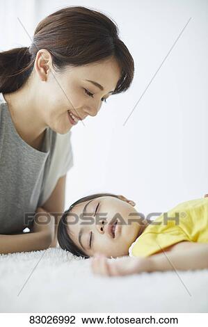 Japanese mother with sleeping kid View Large Photo Image Stock Image - Japanese mother with sleeping kid. Fotosearch