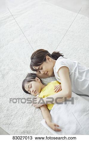 Japanese mother with sleeping kid View Large Photo Image Stock Image - Japanese mother with sleeping kid. Fotosearch
