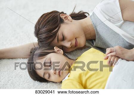 Japanese mother with sleeping kid View Large Photo Image Stock Image - Japanese mother with sleeping kid. Fotosearch