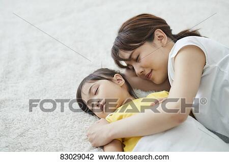 Japanese mother with sleeping kid View Large Photo Image Stock Image - Japanese mother with sleeping kid. Fotosearch