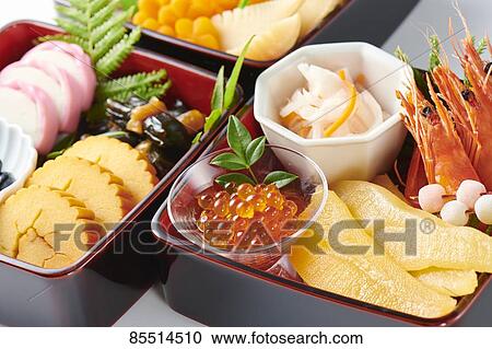 Stock Image - Japanese New Year traditional Osechi dishes. Fotosearch