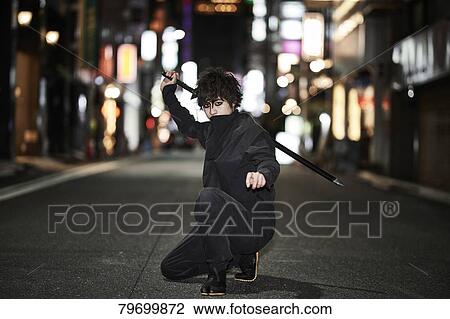 Japanese ninja at night downtown Tokyo View Large Photo Image Stock Image - Japanese ninja at night downtown Tokyo. Fotosearch
