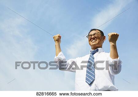 Japanese salaryman against blue sky View Large Photo Image Stock Photography - Japanese salaryman against blue sky. Fotosearch