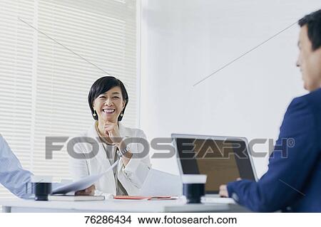 Japanese senior businesswoman having meeting in the office View Large Photo Image Picture - Japanese senior businesswoman having meeting in the office. Fotosearch
