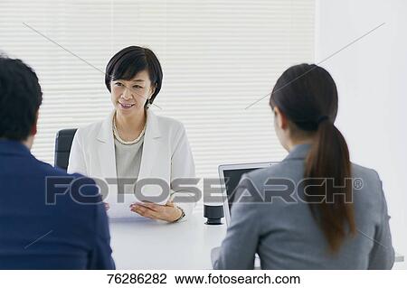 Stock Image - Japanese senior businesswoman having meeting in the office. Fotosearch