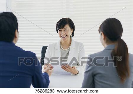Stock Image - Japanese senior businesswoman having meeting in the office. Fotosearch