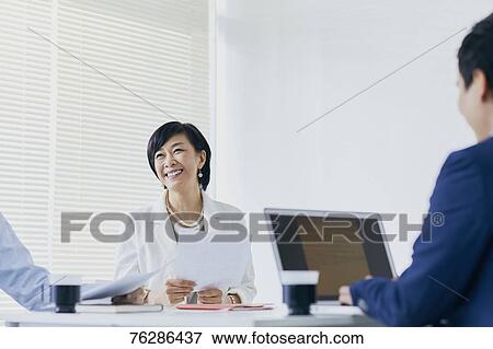 Japanese senior businesswoman having meeting in the office View Large Photo Image Stock Photo - Japanese senior businesswoman having meeting in the office. Fotosearch