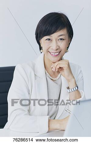 Japanese senior businesswoman in the office View Large Photo Image Picture - Japanese senior businesswoman in the office. Fotosearch