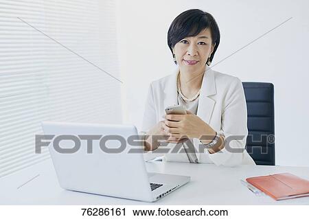 Japanese senior businesswoman in the office View Large Photo Image Stock Image - Japanese senior businesswoman in the office. Fotosearch