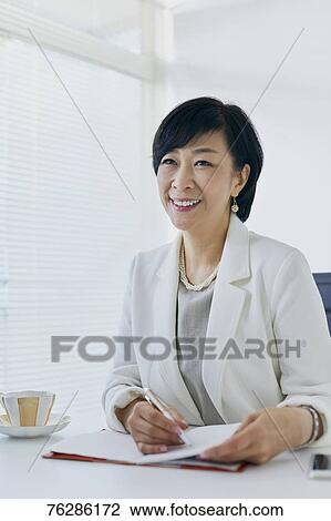 Japanese senior businesswoman in the office View Large Photo Image Stock Image - Japanese senior businesswoman in the office. Fotosearch