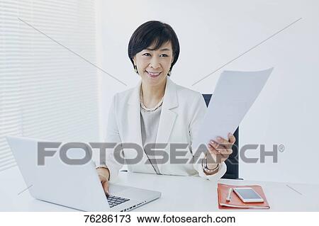 Japanese senior businesswoman in the office View Large Photo Image Stock Image - Japanese senior businesswoman in the office. Fotosearch