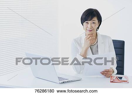 Japanese senior businesswoman in the office View Large Photo Image Stock Image - Japanese senior businesswoman in the office. Fotosearch
