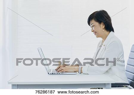 Japanese senior businesswoman in the office View Large Photo Image Stock Photo - Japanese senior businesswoman in the office. Fotosearch