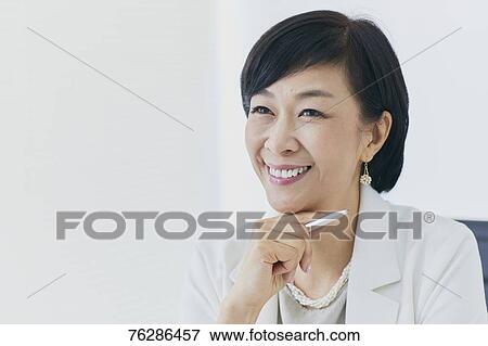 Japanese senior businesswoman in the office View Large Photo Image Stock Photo - Japanese senior businesswoman in the office. Fotosearch