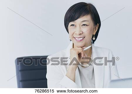 Japanese senior businesswoman in the office View Large Photo Image Stock Photography - Japanese senior businesswoman in the office. Fotosearch