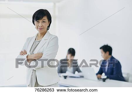 Japanese senior businesswoman with her team View Large Photo Image Stock Image - Japanese senior businesswoman with her team. Fotosearch