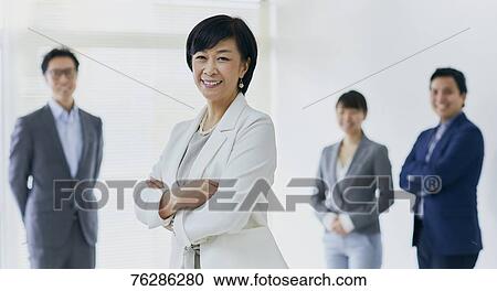 Japanese senior businesswoman with her team View Large Photo Image Stock Image - Japanese senior businesswoman with her team. Fotosearch